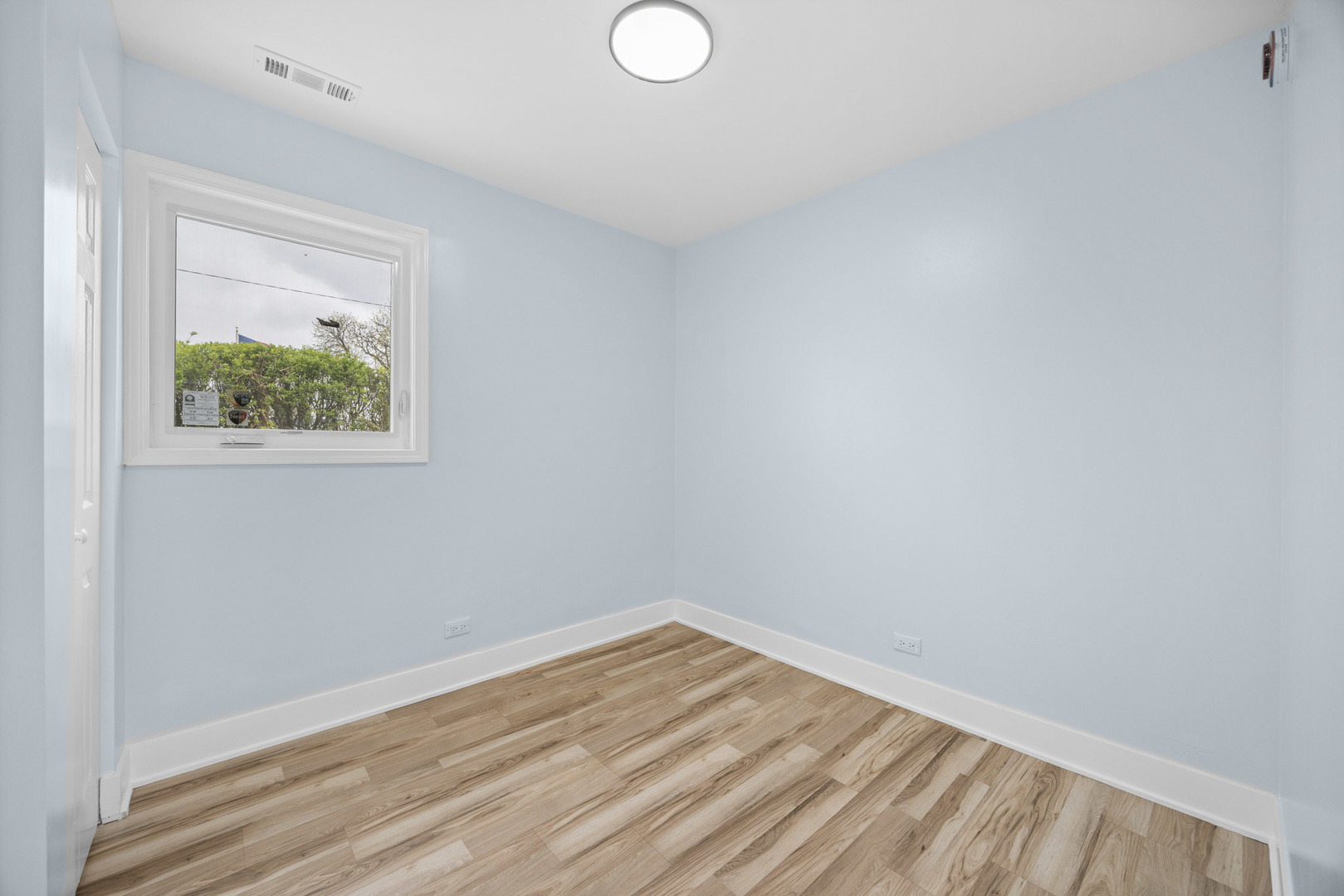 1415 North Taft Avenue Berkeley, IL 60163 - Photo 18 of 24 a view of empty room with wooden floor