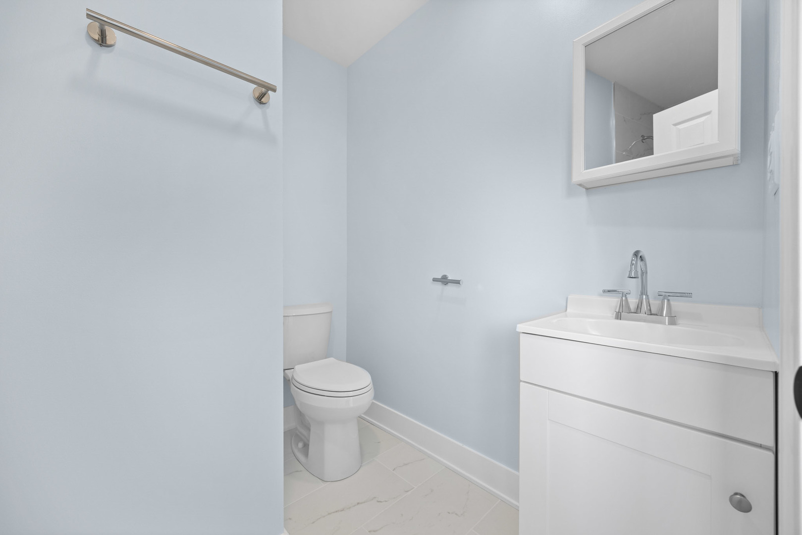 1415 North Taft Avenue Berkeley, IL 60163 - Photo 19 of 24 a bathroom with a toilet sink and mirror