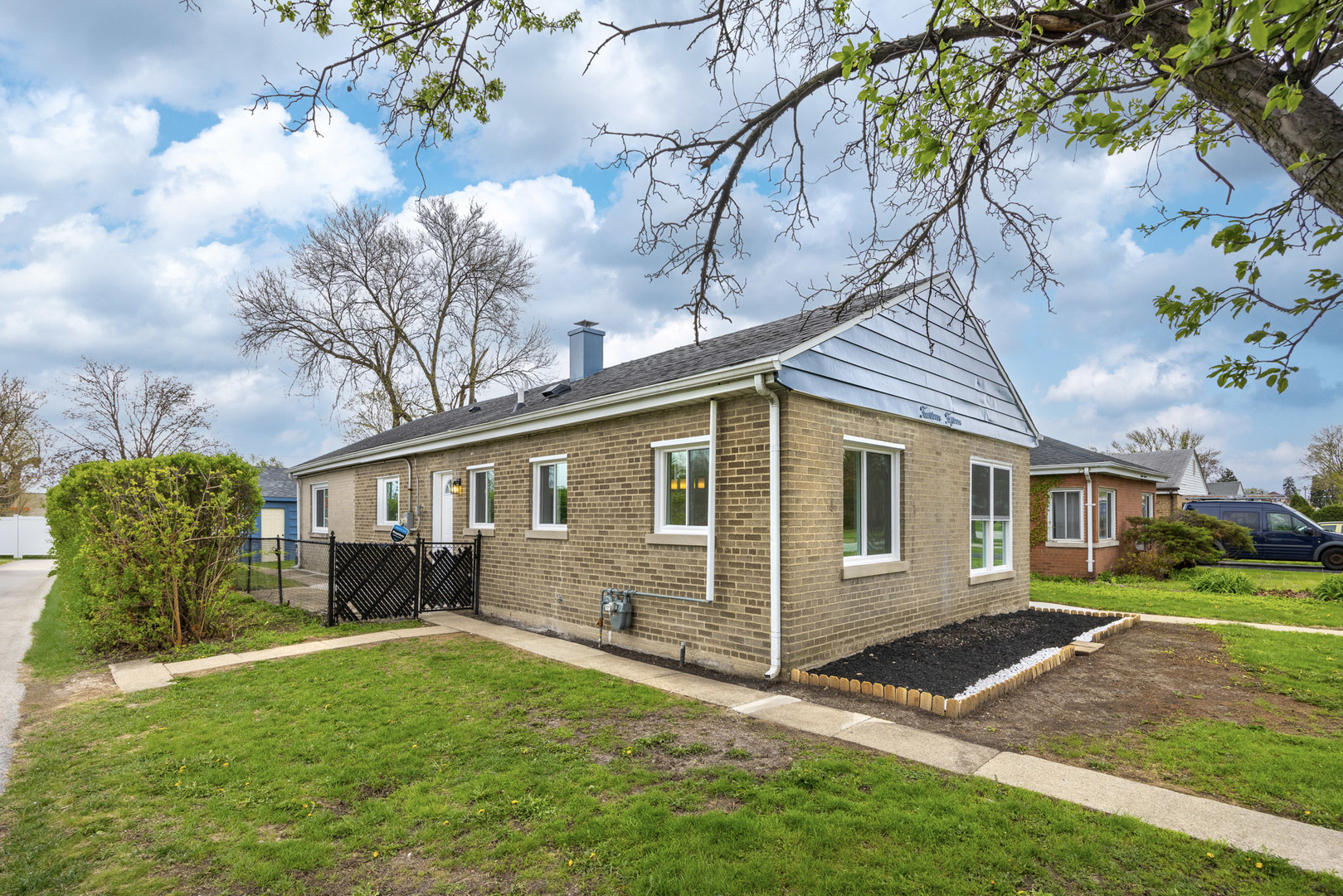 1415 North Taft Avenue Berkeley, IL 60163 - Photo 2 of 24 a front view of a house with garden