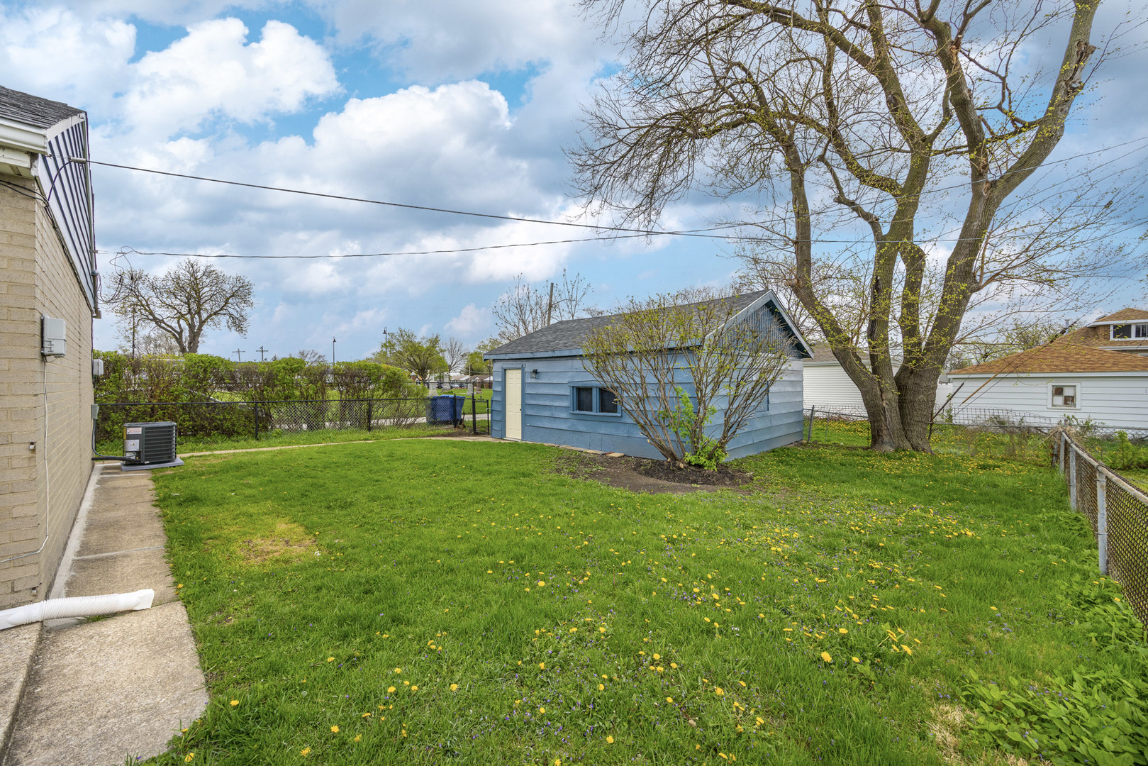 1415 North Taft Avenue Berkeley, IL 60163 - Photo 24 of 24 a view of a house with a back yard