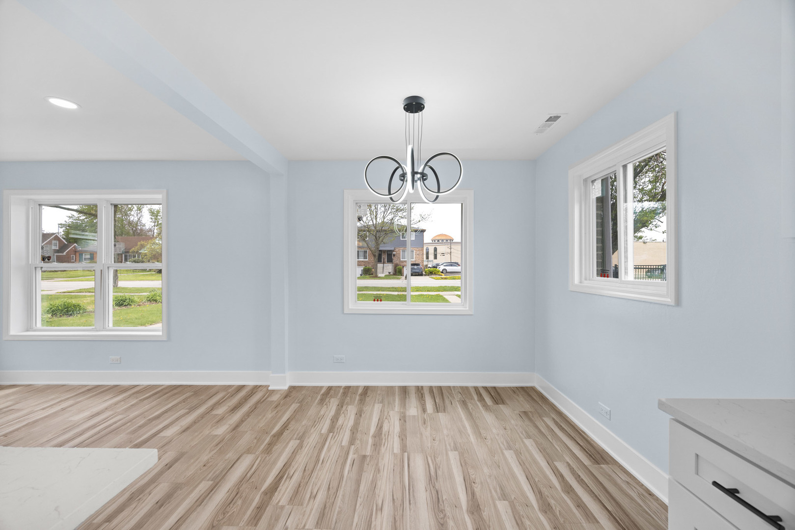 1415 North Taft Avenue Berkeley, IL 60163 - Photo 6 of 24 a view of empty room with window and wooden floor