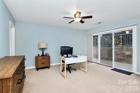 a workspace with furniture and window