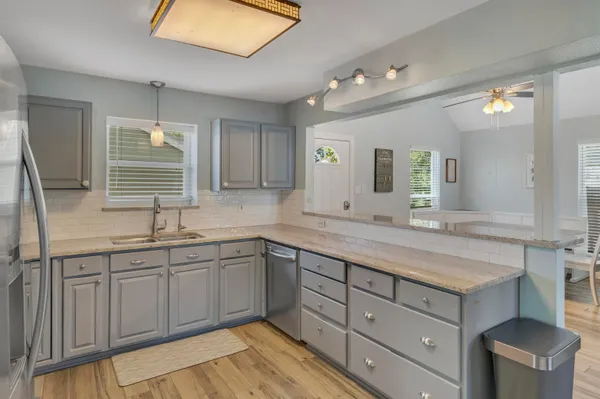 a bathroom with a sink double vanity granite and a mirror