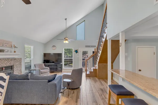 a living room with furniture fireplace and flat screen tv
