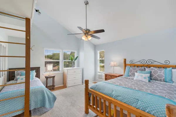 a bedroom with a large bed and a window
