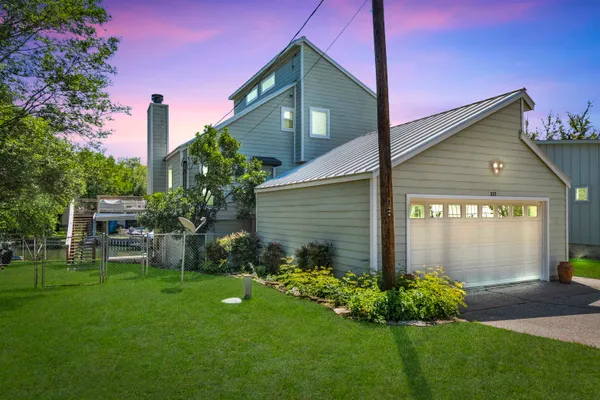 a front view of a house with garden