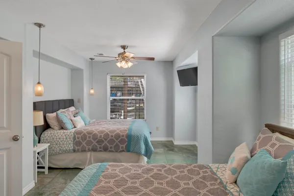 a bedroom with bed and window