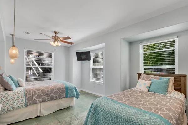 a bedroom with a large bed and a window