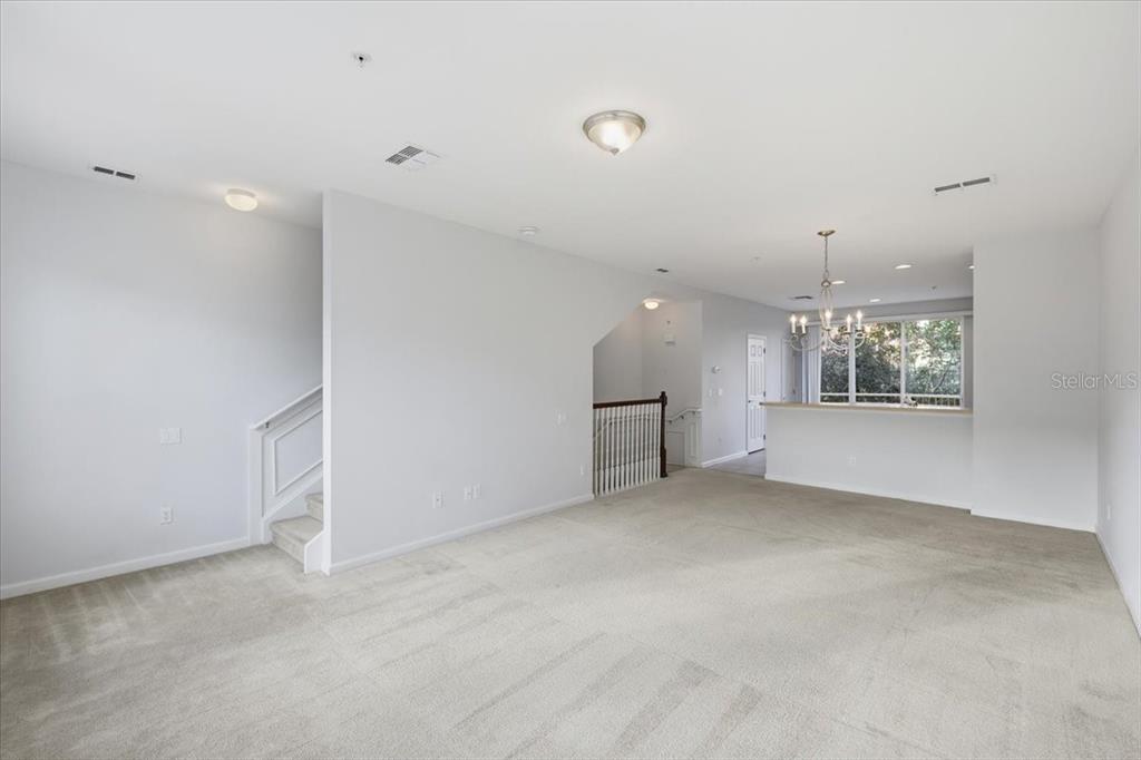 5026 Tideview Circle, Unit 12 Orlando, FL 32819 - Photo 10 of 41 an empty room with a empty space and windows