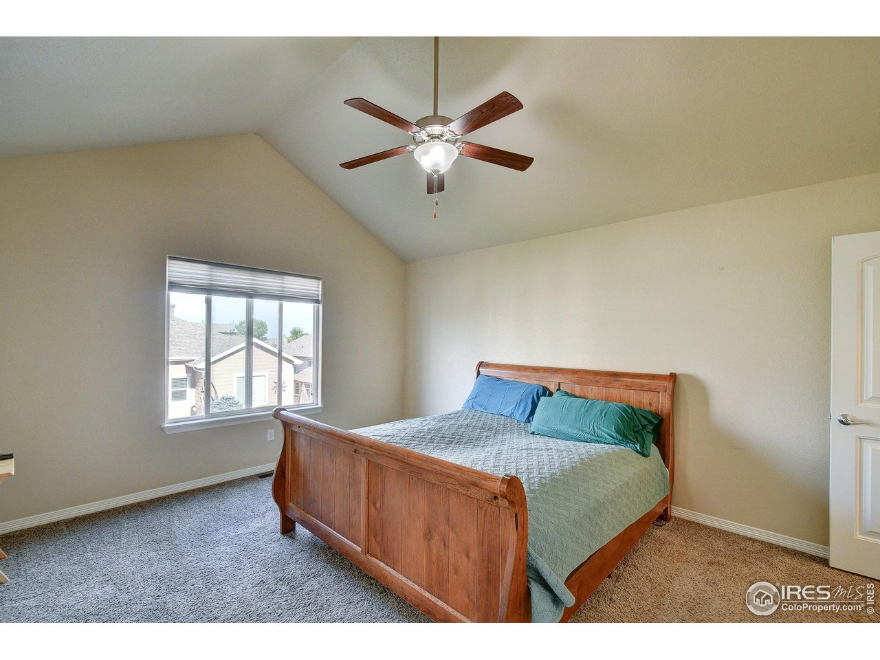 6743 Sequoia Street Frederick, CO 80530 - Photo 13 of 39 a bedroom with a bed and window