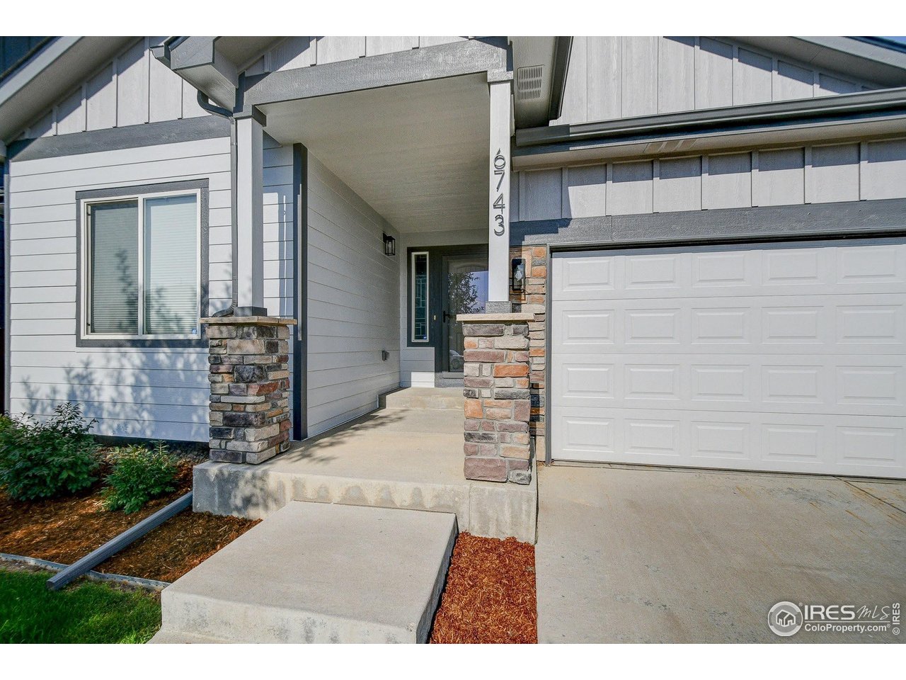 6743 Sequoia Street Frederick, CO 80530 - Photo 2 of 39 a view of a house with a door and wooden floor