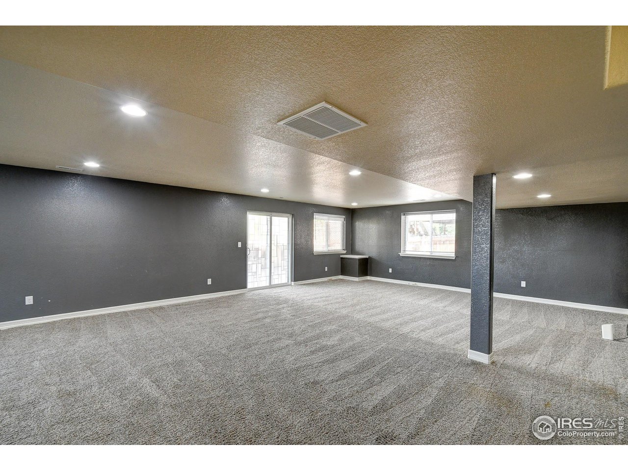 6743 Sequoia Street Frederick, CO 80530 - Photo 21 of 39 a view of an empty room and window