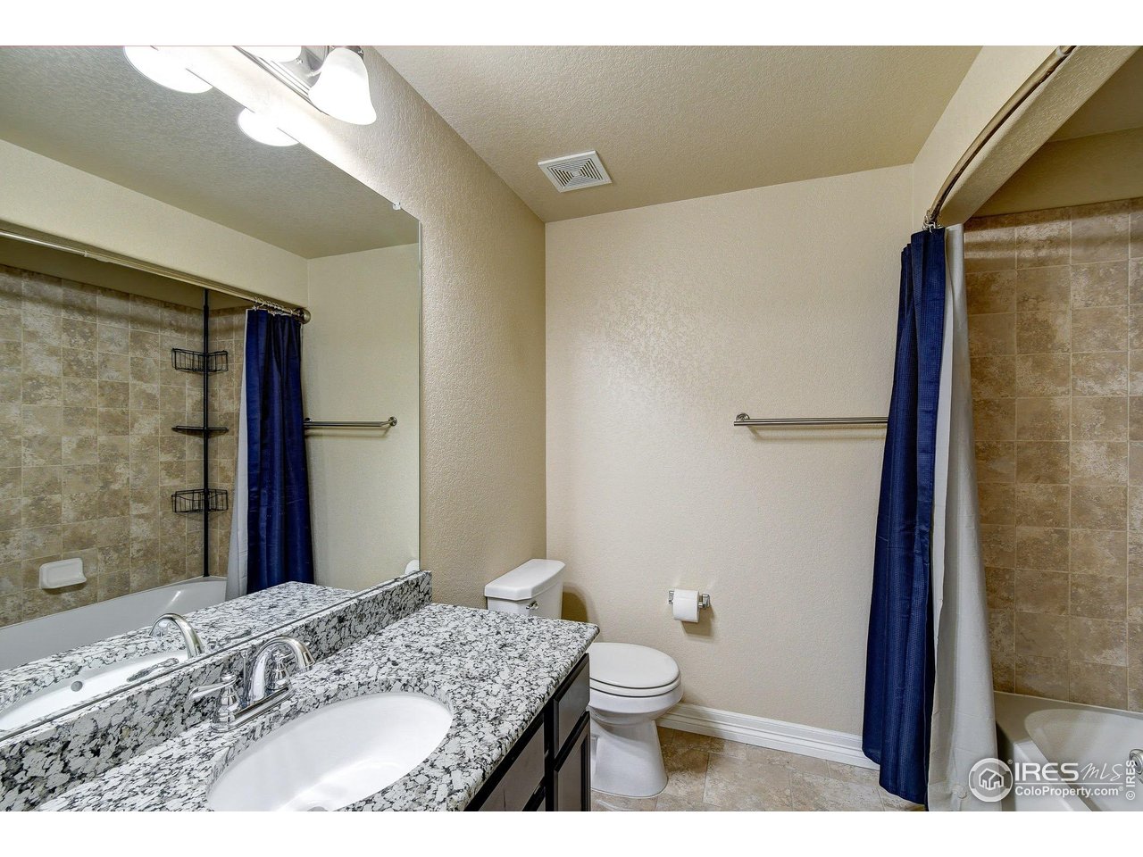 6743 Sequoia Street Frederick, CO 80530 - Photo 28 of 39 a bathroom with a granite countertop sink toilet and shower