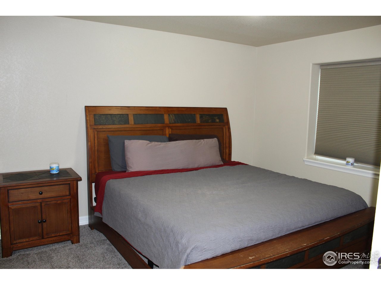 6743 Sequoia Street Frederick, CO 80530 - Photo 31 of 39 a bedroom with a bed and with furniture