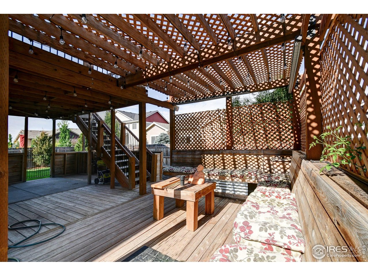 6743 Sequoia Street Frederick, CO 80530 - Photo 32 of 39 a view of a patio with wooden floor