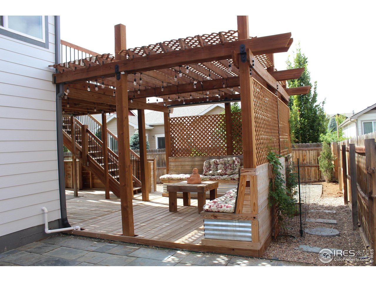 6743 Sequoia Street Frederick, CO 80530 - Photo 33 of 39 a view of a patio with a table and chairs