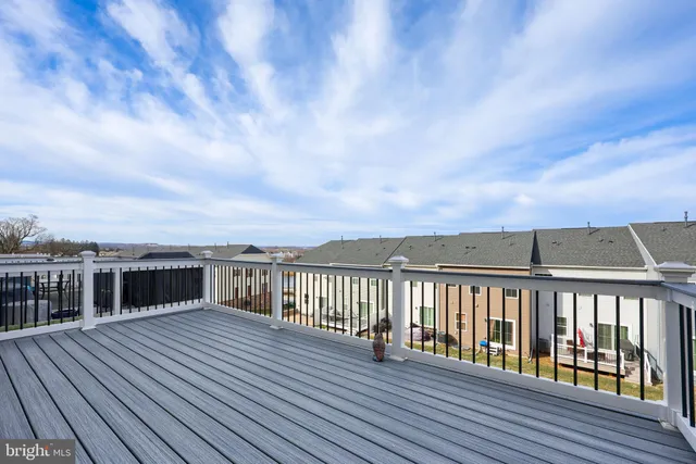 a view of balcony with wooden floor