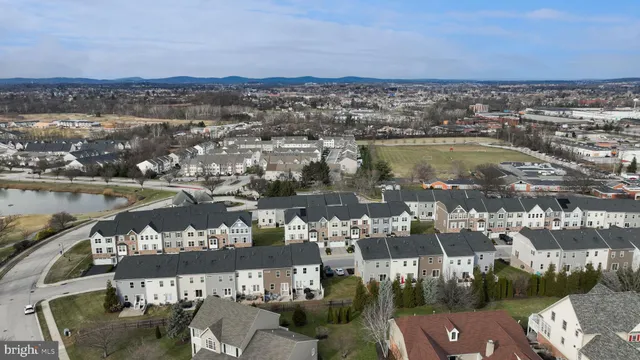 a front view of a house with a garden and deck
