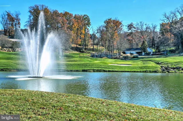 a view of a lake with a building in the background