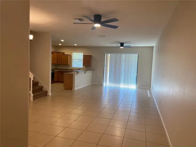 a view of a livingroom with a kitchen