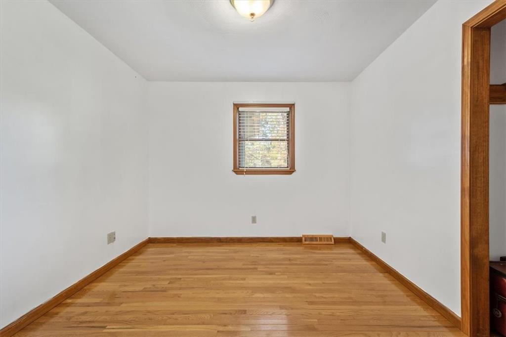 140 Curry Road Burgettstown, PA 15021 - Photo 18 of 25 a view of an empty room with wooden floor
