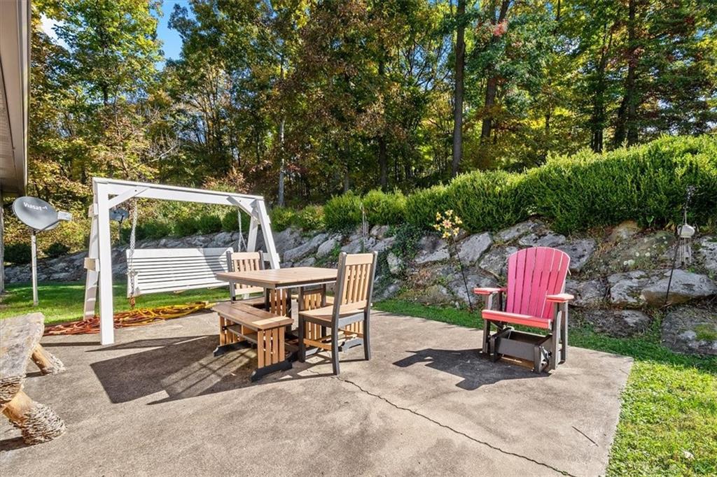 140 Curry Road Burgettstown, PA 15021 - Photo 21 of 25 a view of a chair and table in backyard of the house