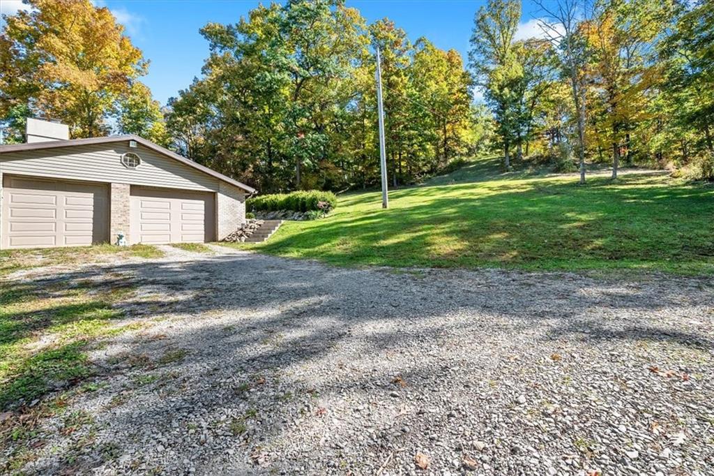 140 Curry Road Burgettstown, PA 15021 - Photo 23 of 25 a view of a house with backyard and trees