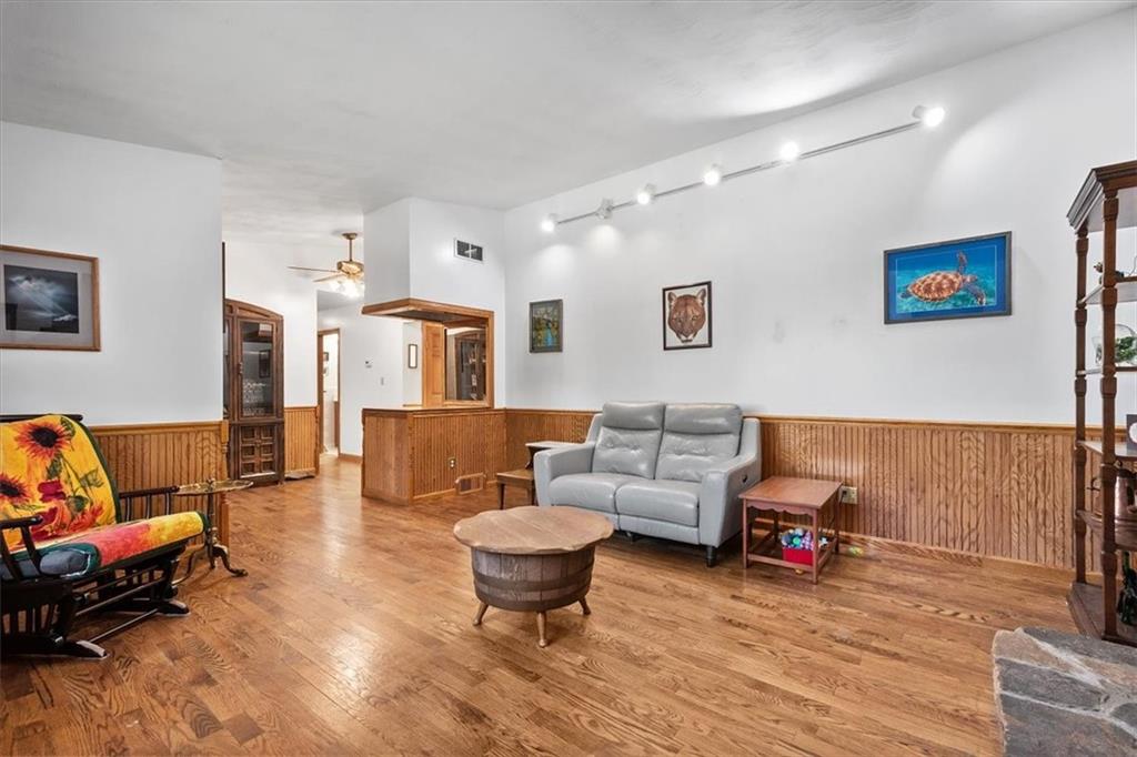 140 Curry Road Burgettstown, PA 15021 - Photo 8 of 25 a living room with furniture and a wooden floor