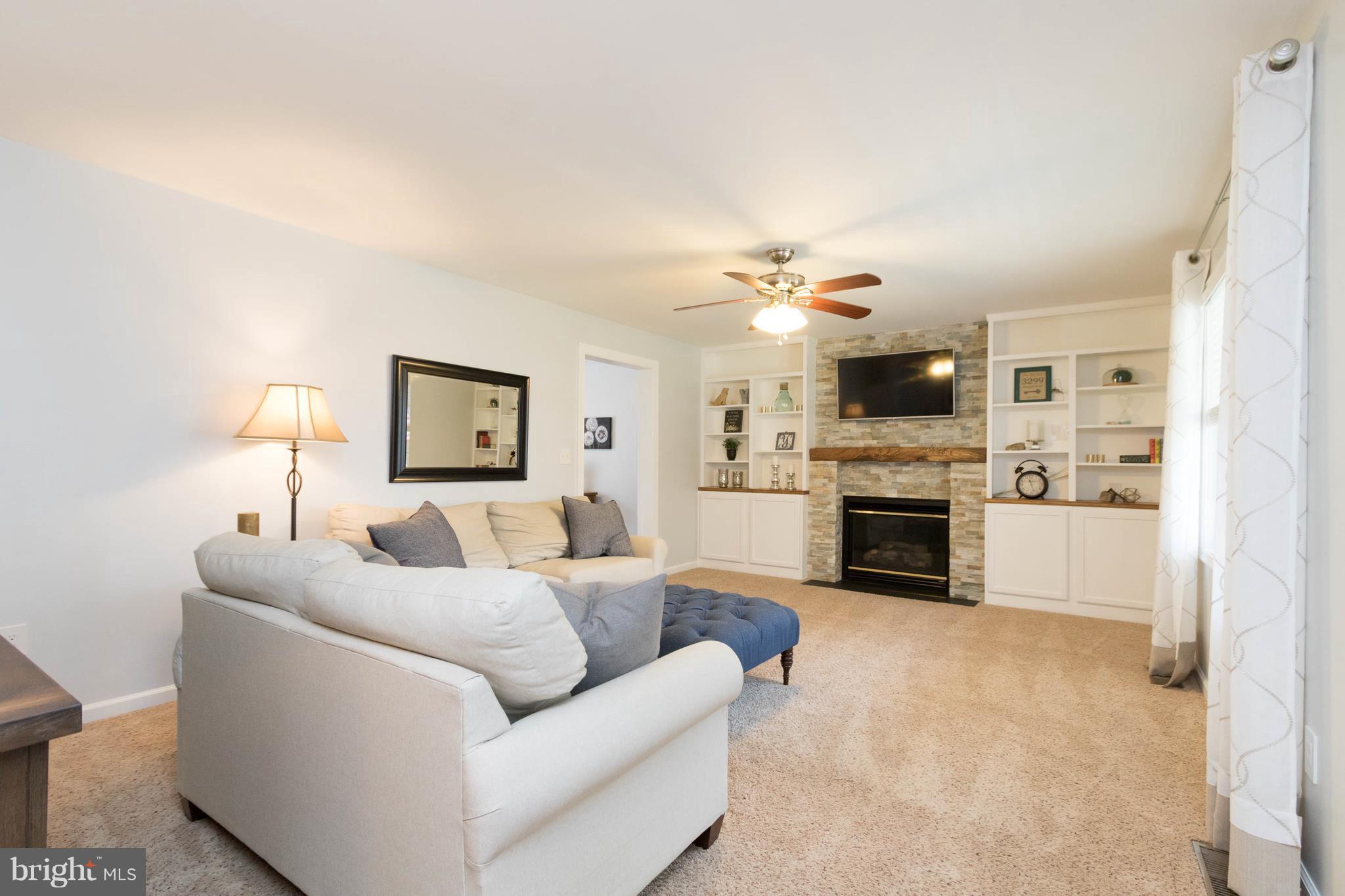 3299 Stingray Road Goldvein, VA 22720 - Photo 10 of 30 Living Room with Stacked Fireplace and Built-Ins