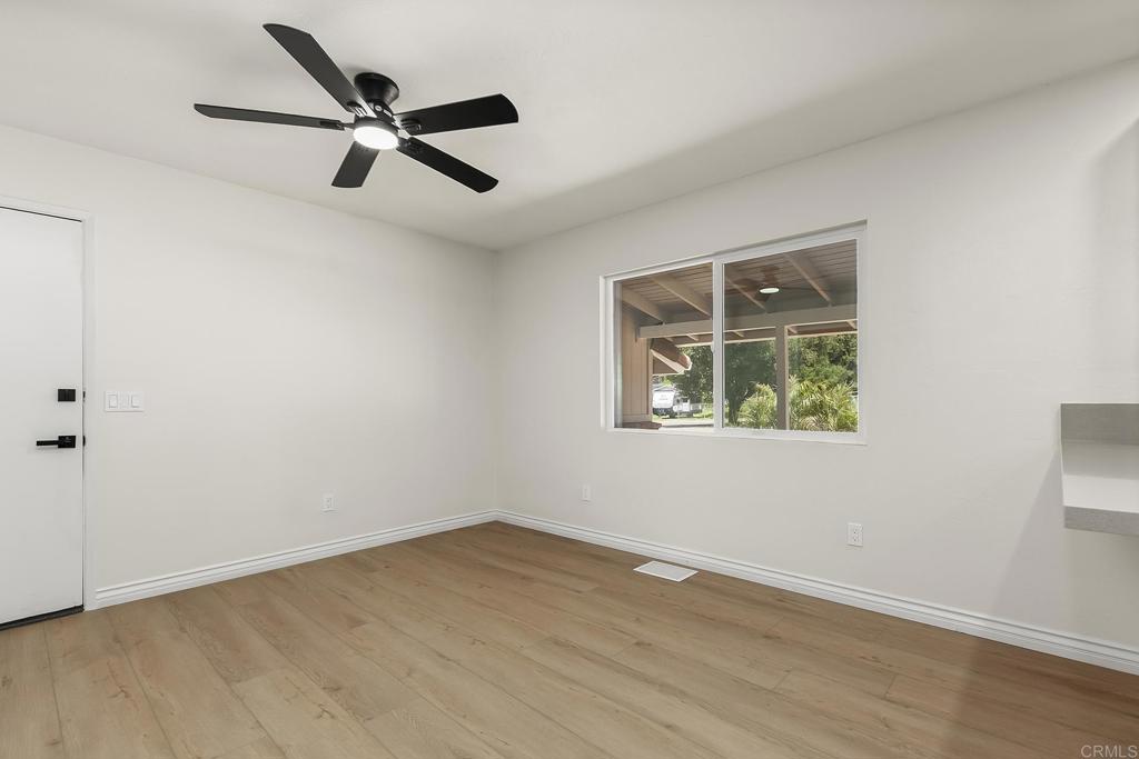 13500 Jamul Drive Jamul, CA 91935 - Photo 13 of 39 wooden floor in an empty room with a window