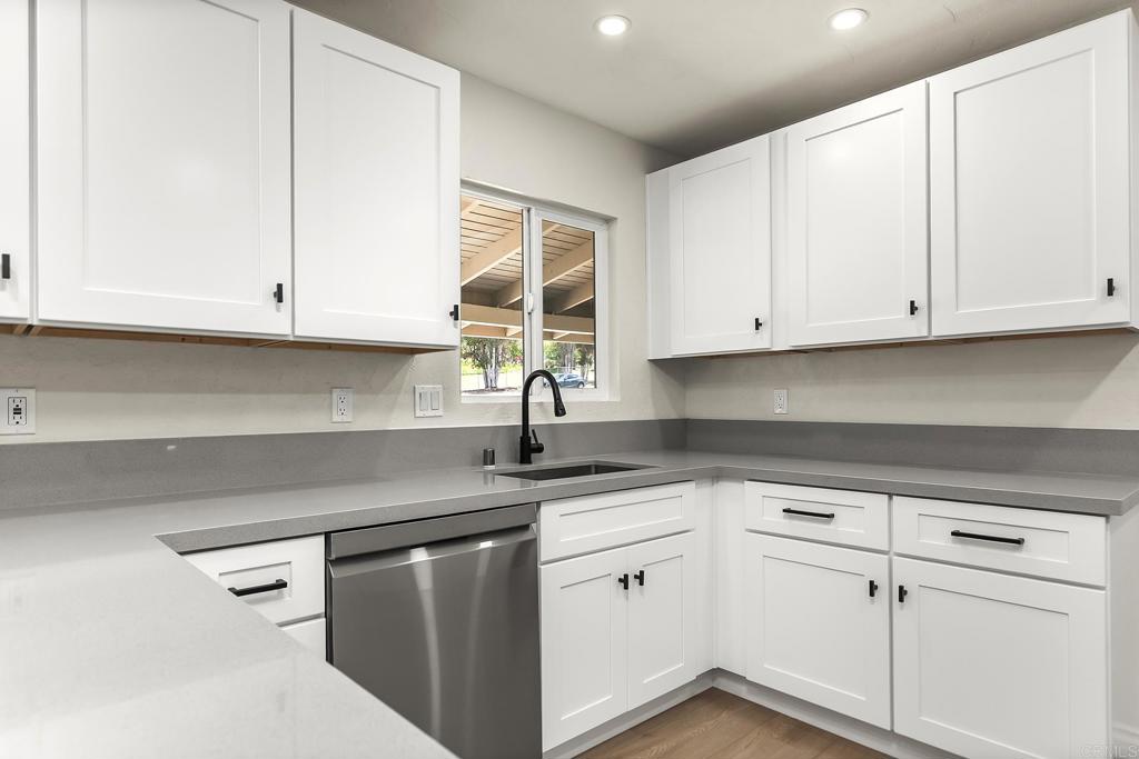 13500 Jamul Drive Jamul, CA 91935 - Photo 16 of 39 a kitchen with stainless steel appliances granite countertop white cabinets sink and dishwasher