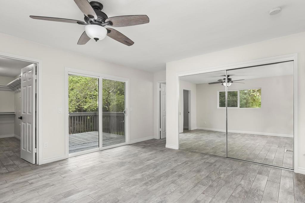 13500 Jamul Drive Jamul, CA 91935 - Photo 20 of 39 a view of a room with wooden floor and ceiling fan
