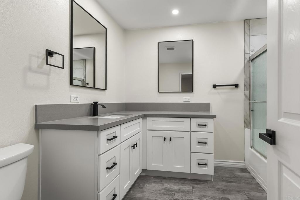 13500 Jamul Drive Jamul, CA 91935 - Photo 26 of 39 a spacious bathroom with a double vanity sink and a mirror