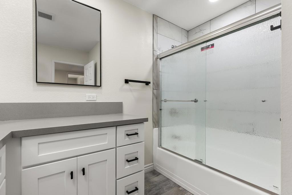 13500 Jamul Drive Jamul, CA 91935 - Photo 27 of 39 a bathroom with a bathtub and a shower