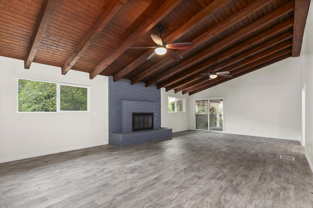 13500 Jamul Drive Jamul, CA 91935 - Photo 3 of 39 a view of an empty room with a fireplace and a window