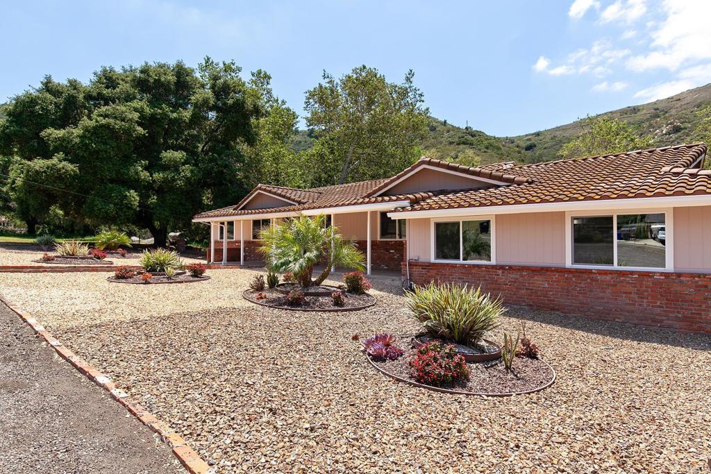 13500 Jamul Drive Jamul, CA 91935 - Photo 8 of 39 a view of a house with backyard sitting area and porch