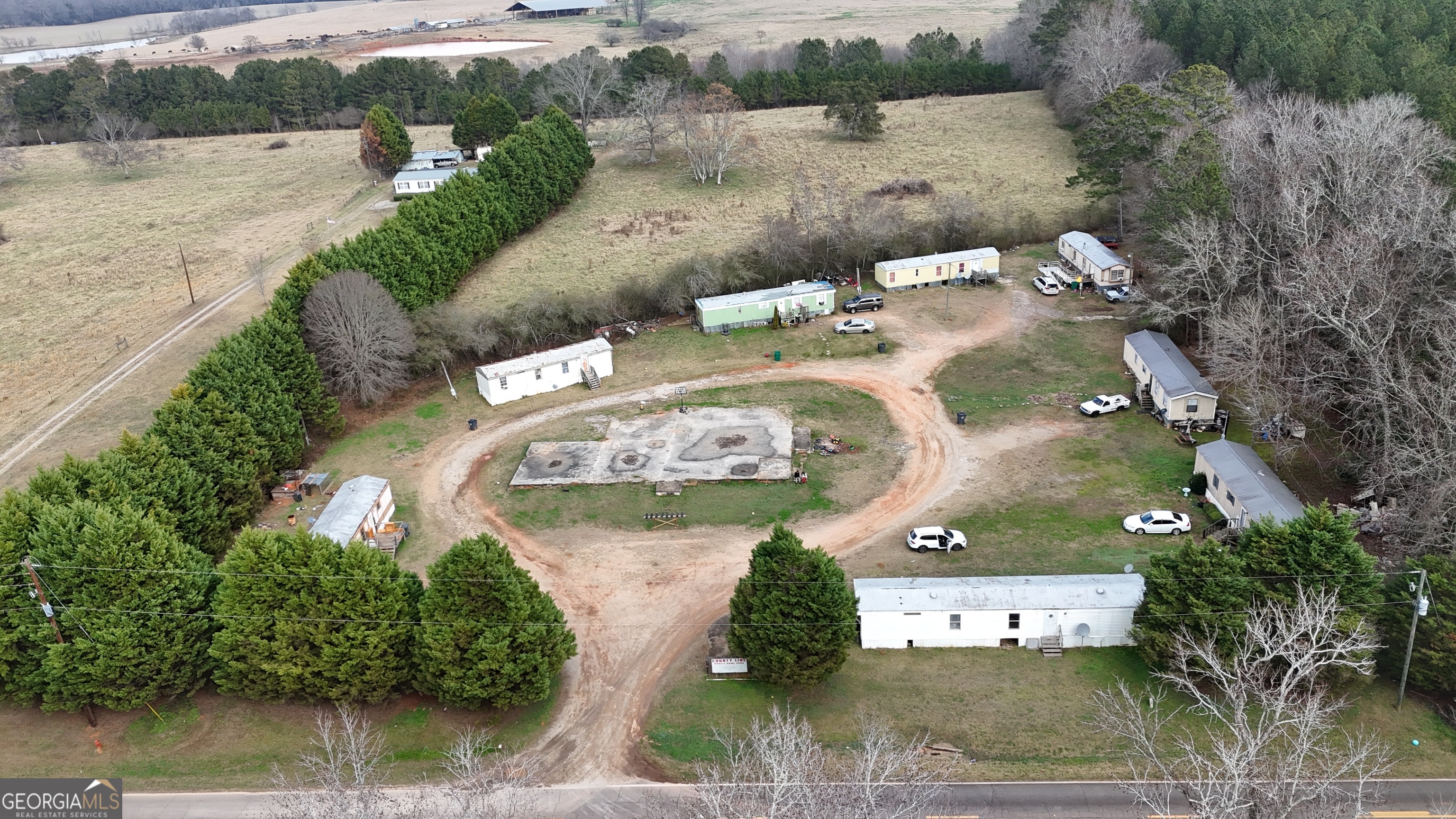 4334 Log Cabin Road Southwest White Plains, GA 30678 - Photo 18 of 20 an aerial view of a house with outdoor space and lake view
