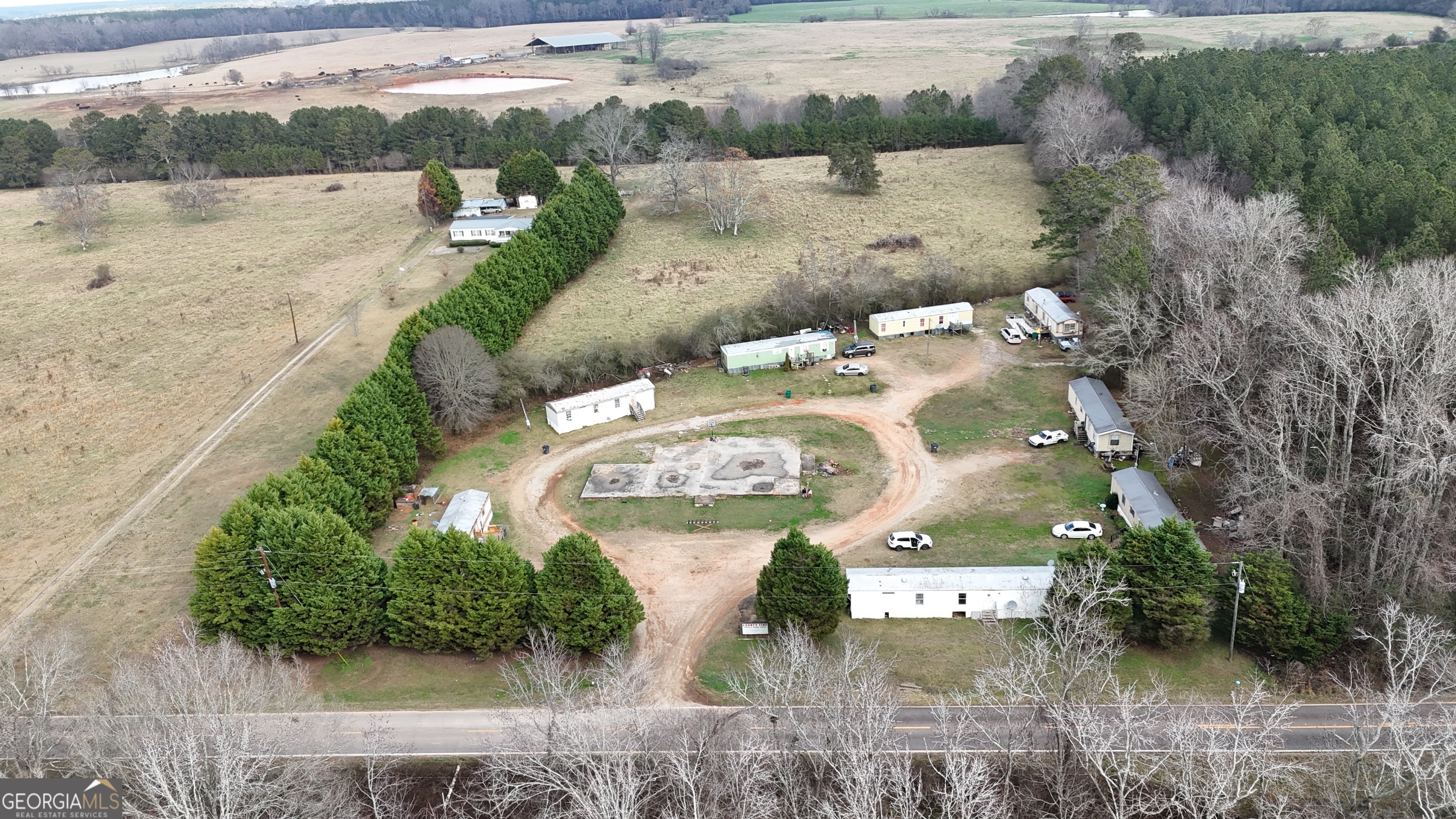 4334 Log Cabin Road Southwest White Plains, GA 30678 - Photo 19 of 20 an aerial view of a house with a lake view