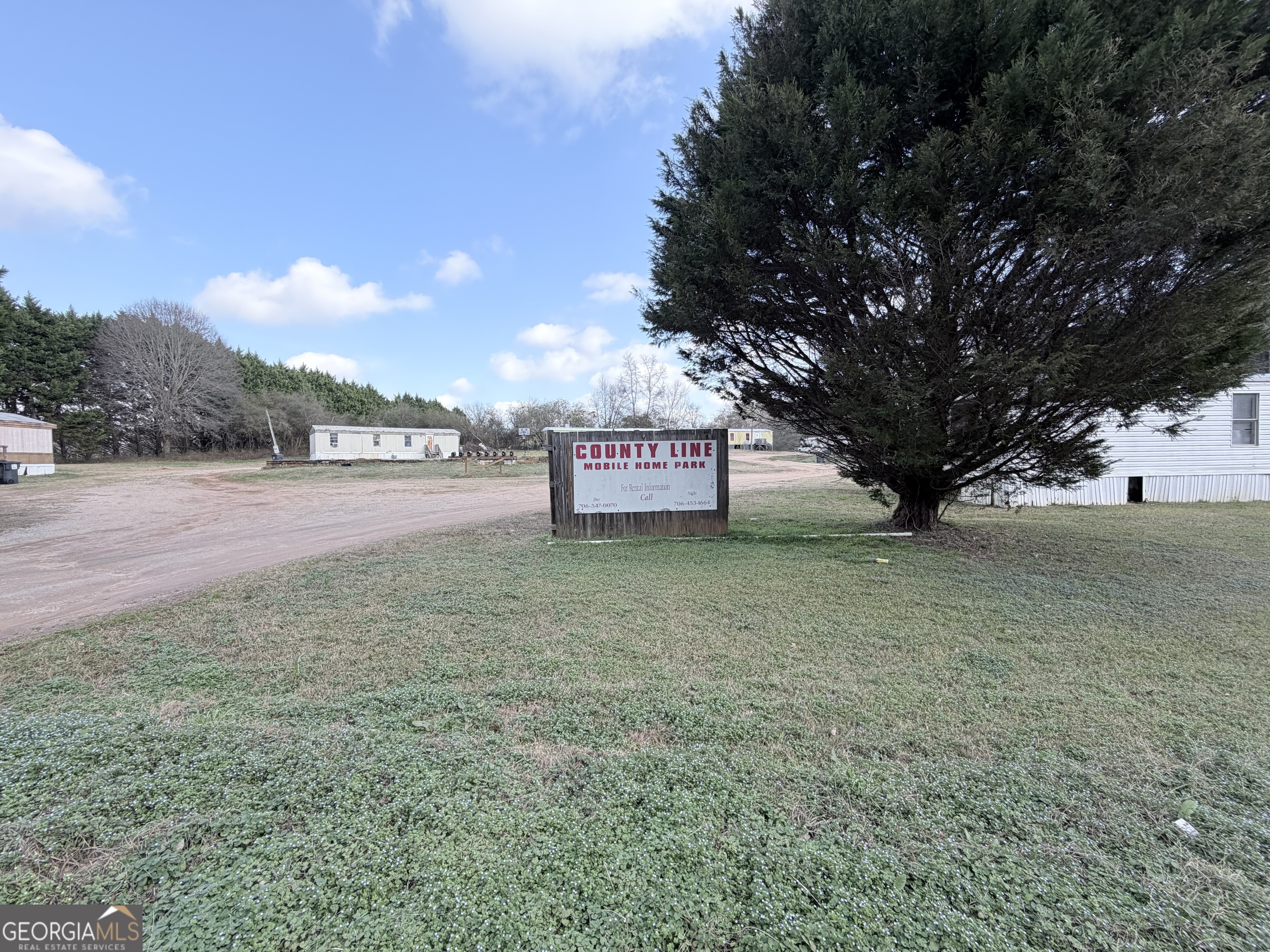 4334 Log Cabin Road Southwest White Plains, GA 30678 - Photo 2 of 20 a view of a park with large trees