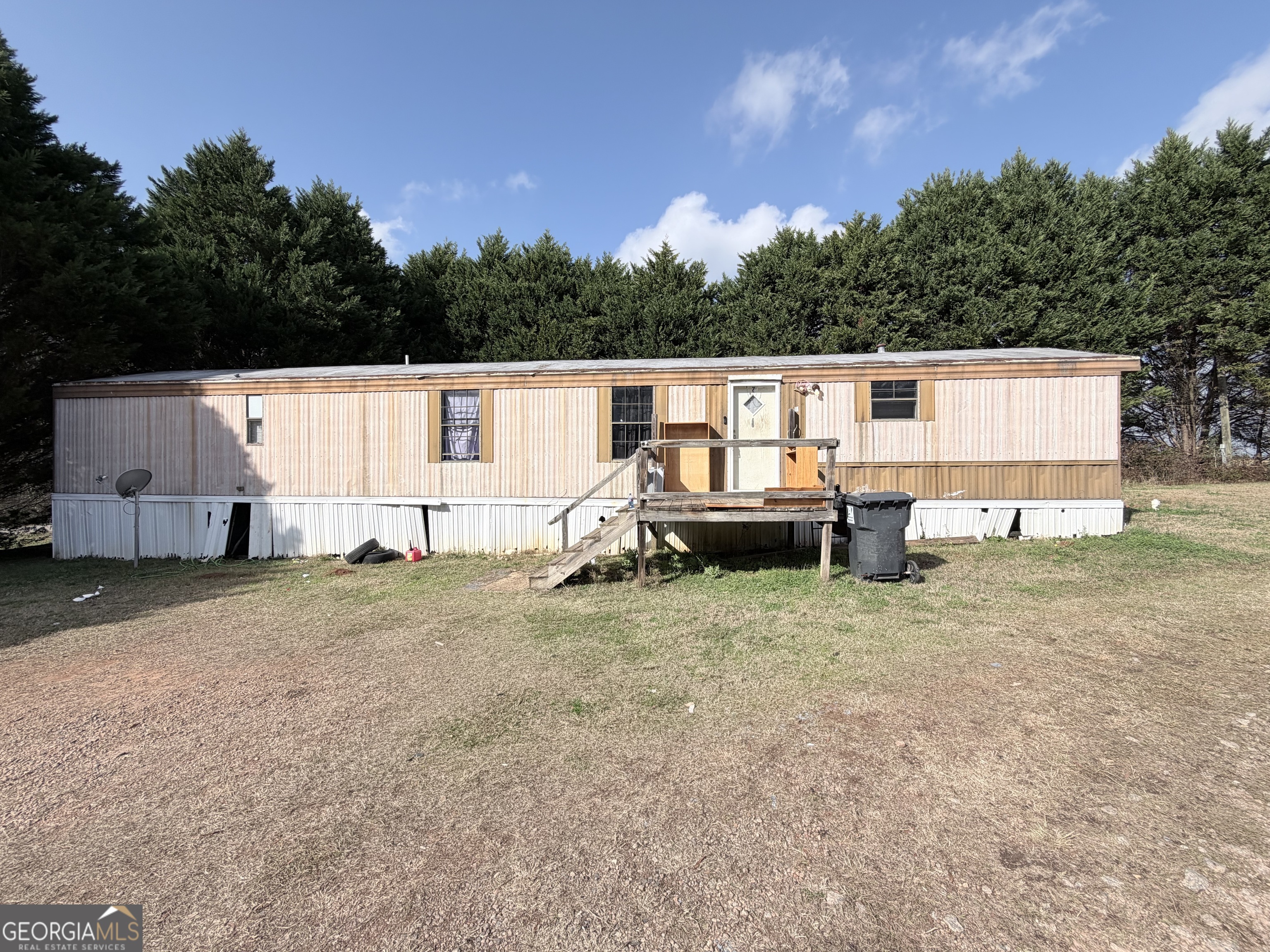4334 Log Cabin Road Southwest White Plains, GA 30678 - Photo 3 of 20 a view of a house with backyard and sitting area
