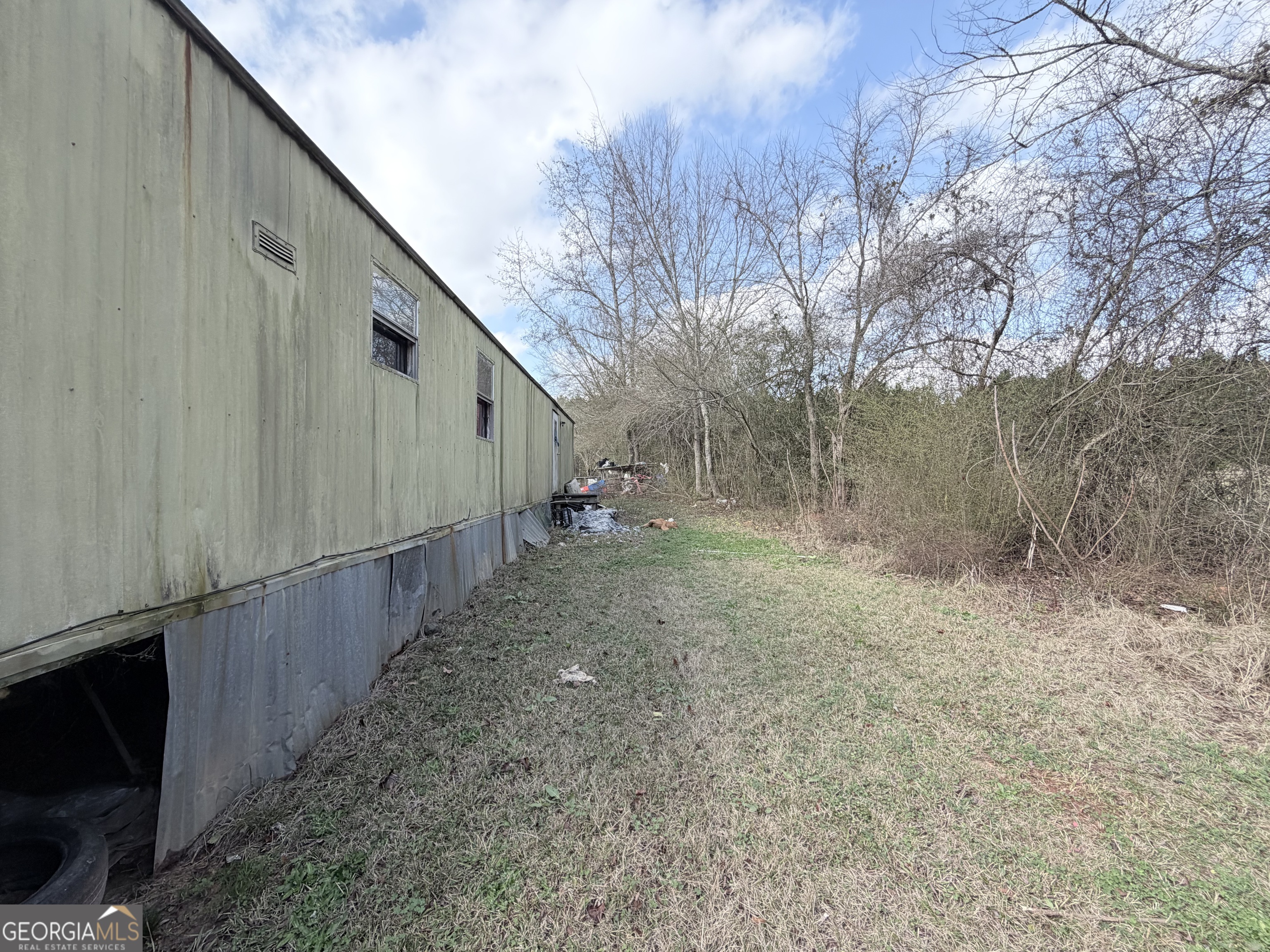 4334 Log Cabin Road Southwest White Plains, GA 30678 - Photo 9 of 20 a view of a back yard of the house