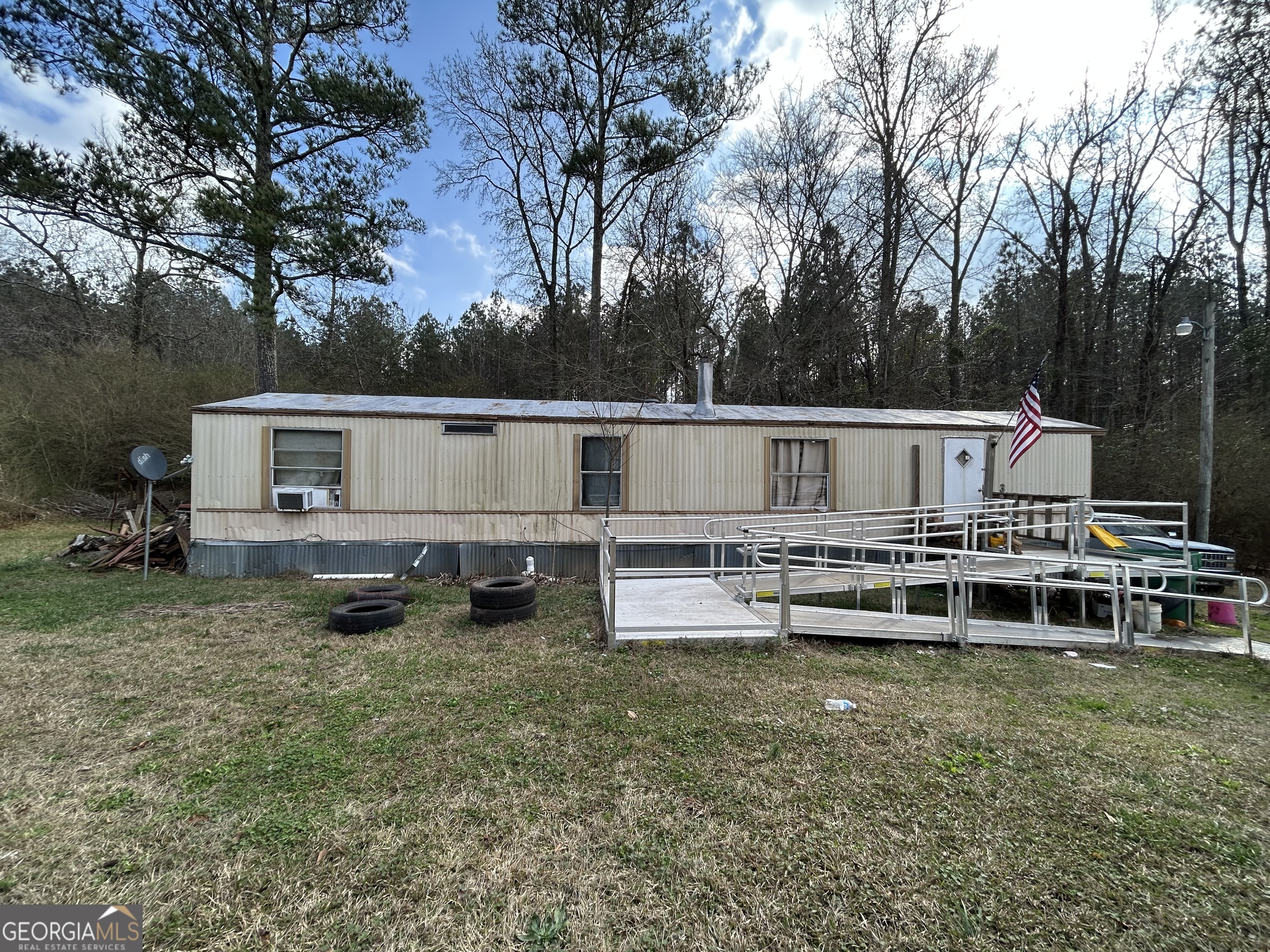 4334 Log Cabin Road Southwest White Plains, GA 30678 - Photo 10 of 20 a view of a house with backyard and sitting area