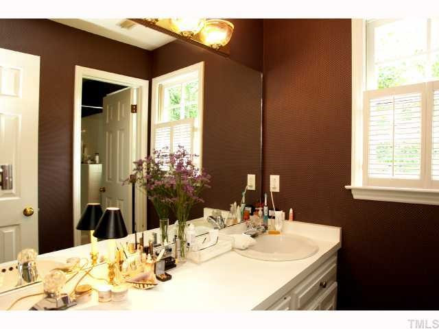 2825 Van Dyke Avenue Raleigh, NC 27607 - Photo 11 of 12 Also, upstairs is a very large hall bathroom AND separate dressing area with dual sinks and plenty of cabinet storage. Tile floors are in the shower/toilet area Bathroom