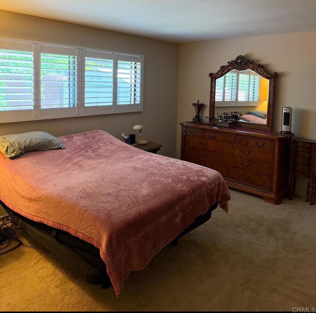 9168 Old Castle Road Valley Center, CA 92082 - Photo 12 of 14 a bedroom with a bed and a view of living room