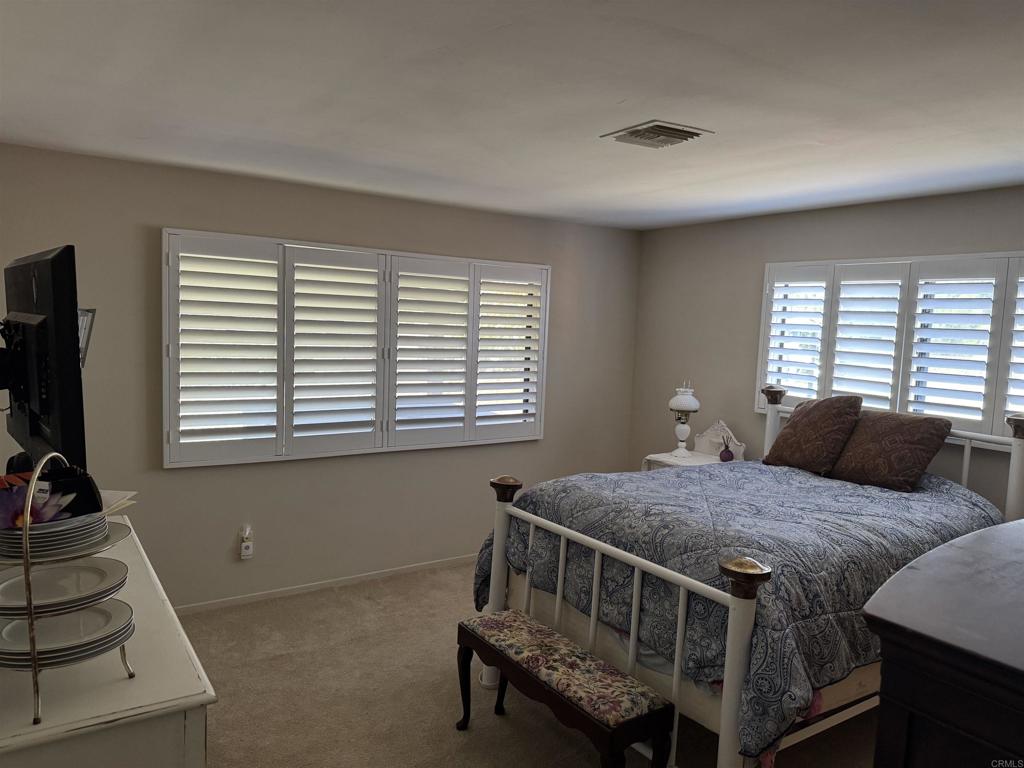 9168 Old Castle Road Valley Center, CA 92082 - Photo 13 of 14 a bedroom with a bed and a window