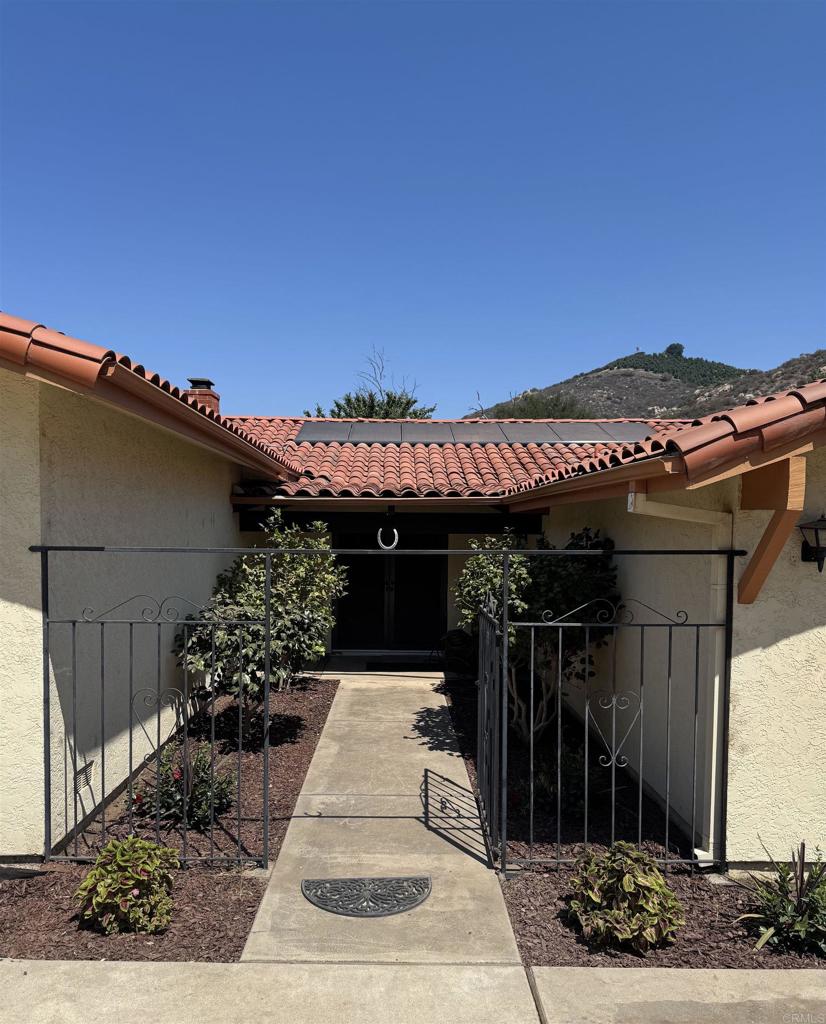 9168 Old Castle Road Valley Center, CA 92082 - Photo 2 of 14 a view of a house with a patio