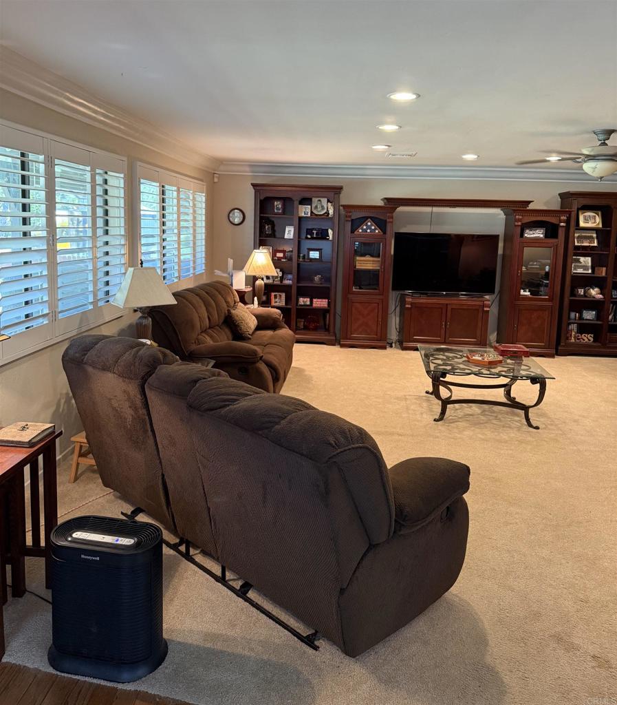 9168 Old Castle Road Valley Center, CA 92082 - Photo 4 of 14 a living room with furniture gym equipment and a large window