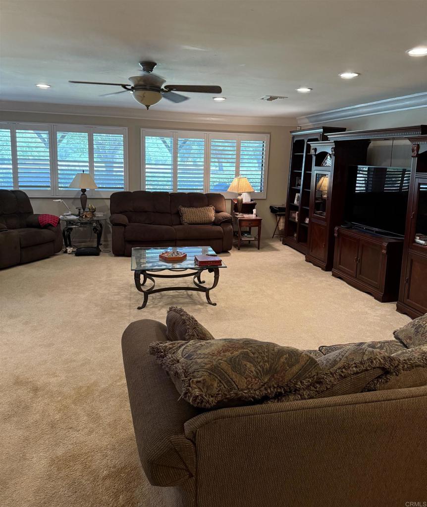 9168 Old Castle Road Valley Center, CA 92082 - Photo 5 of 14 a living room with furniture a large window and flat screen tv
