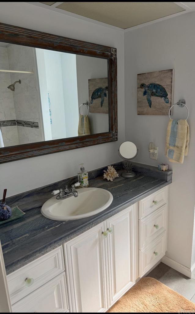 9168 Old Castle Road Valley Center, CA 92082 - Photo 10 of 14 a bathroom with a sink and a mirror