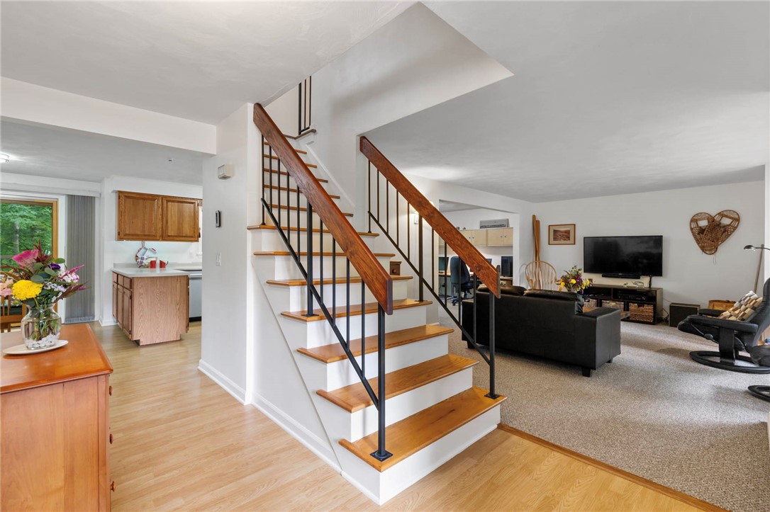 693 Ashdon Circle Webster, NY 14580 - Photo 4 of 50 Open stairway to kitchen and living room